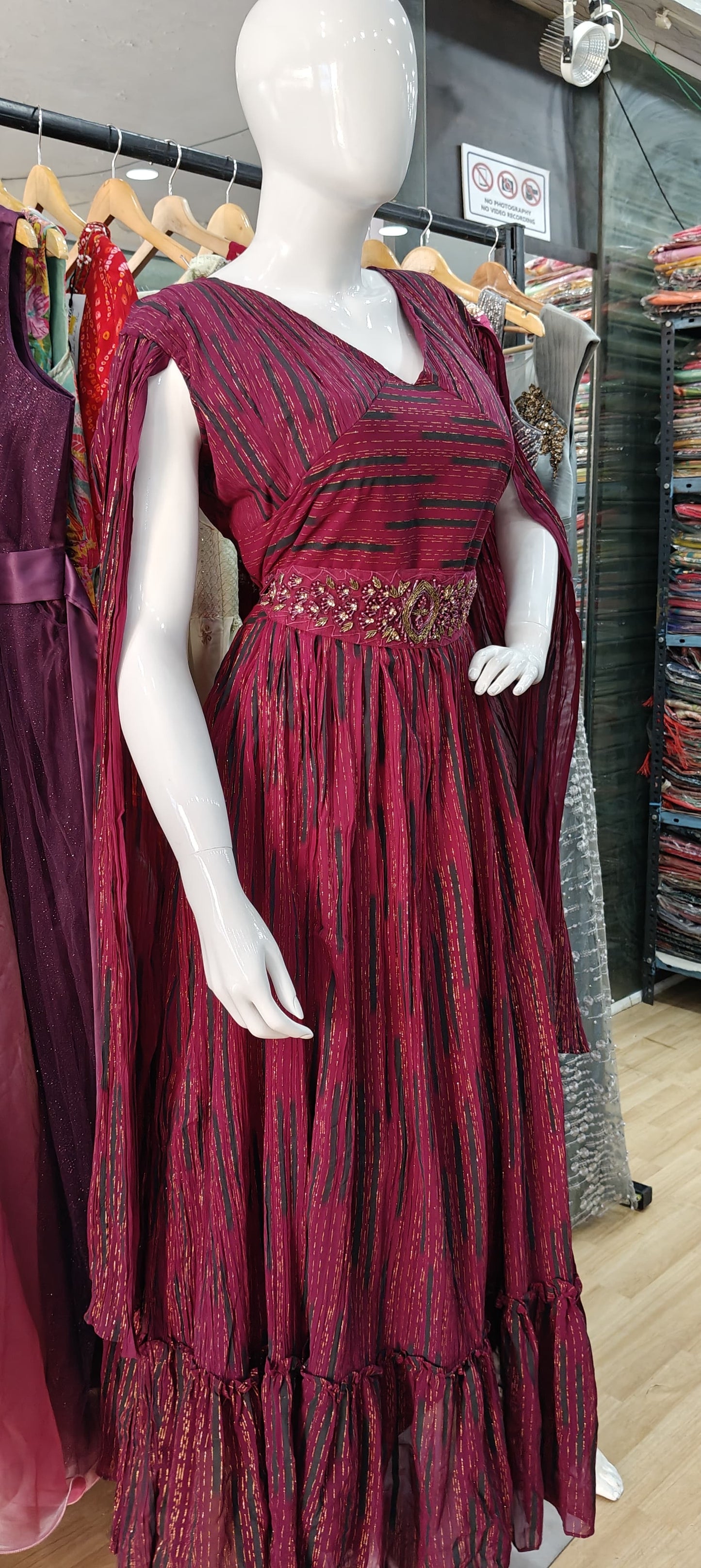 Designer Maroon long sleeves gown with embellished belt