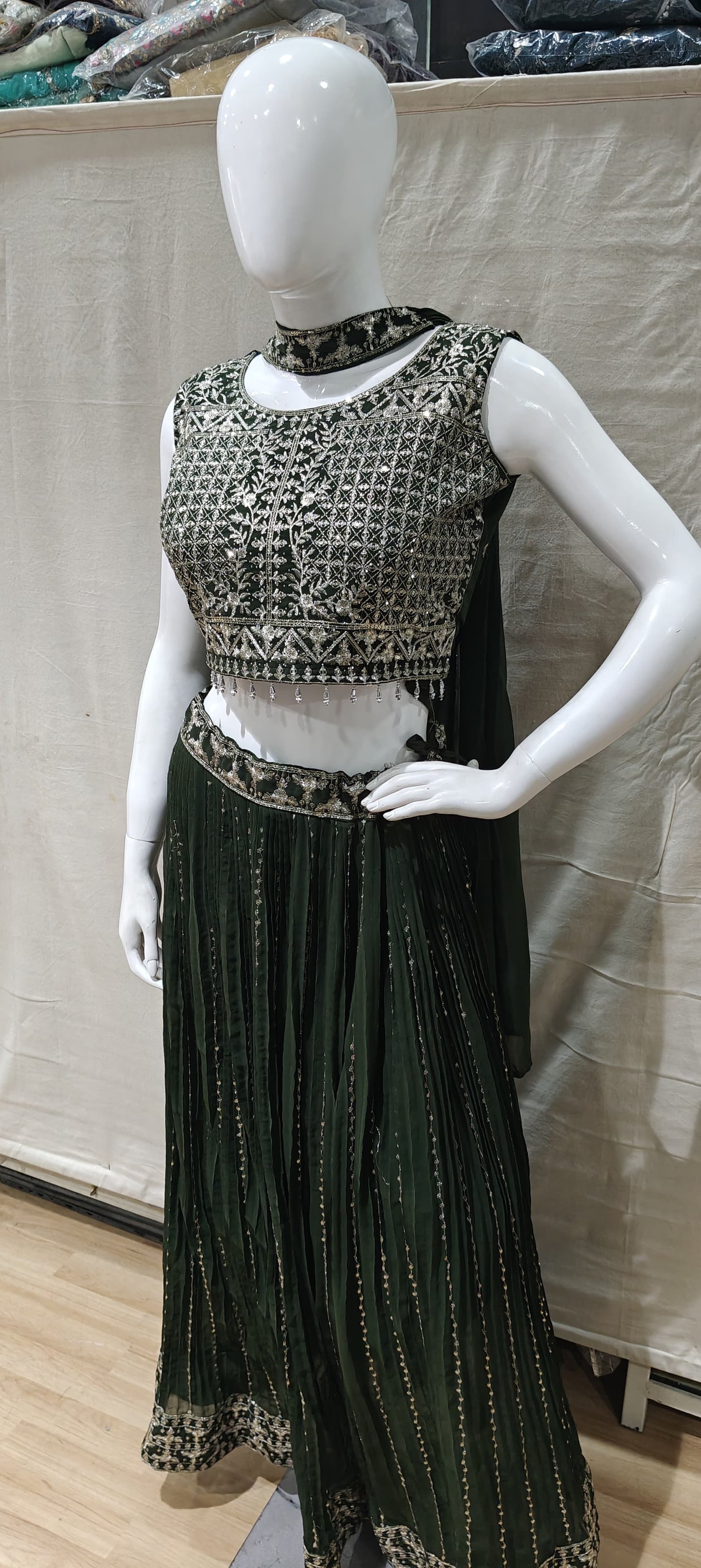 Silver zari work on green lehenga
