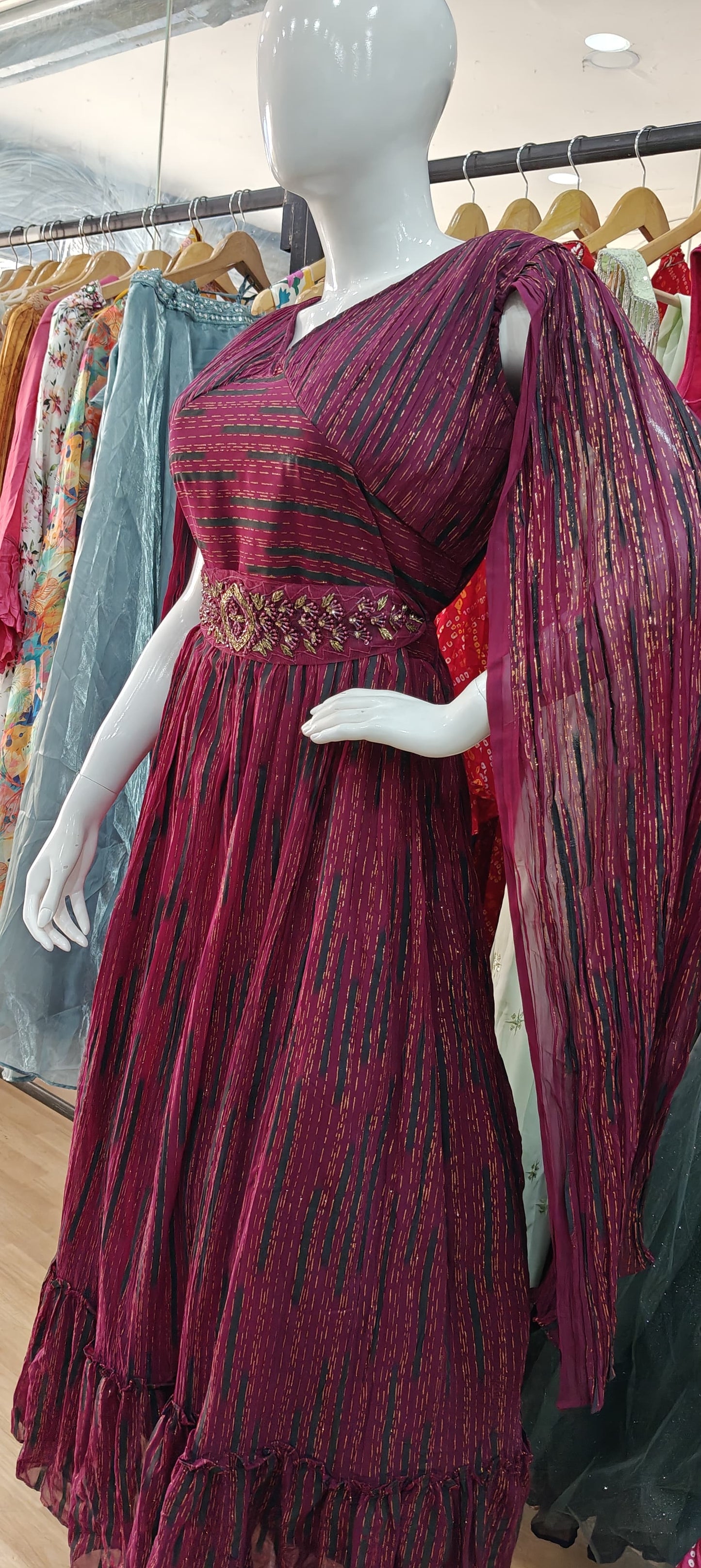 Designer Maroon long sleeves gown with embellished belt