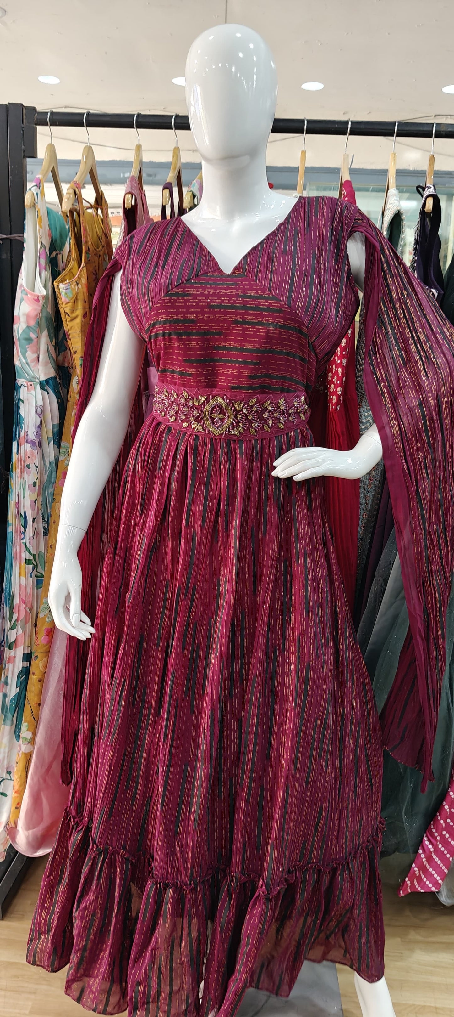 Designer Maroon long sleeves gown with embellished belt