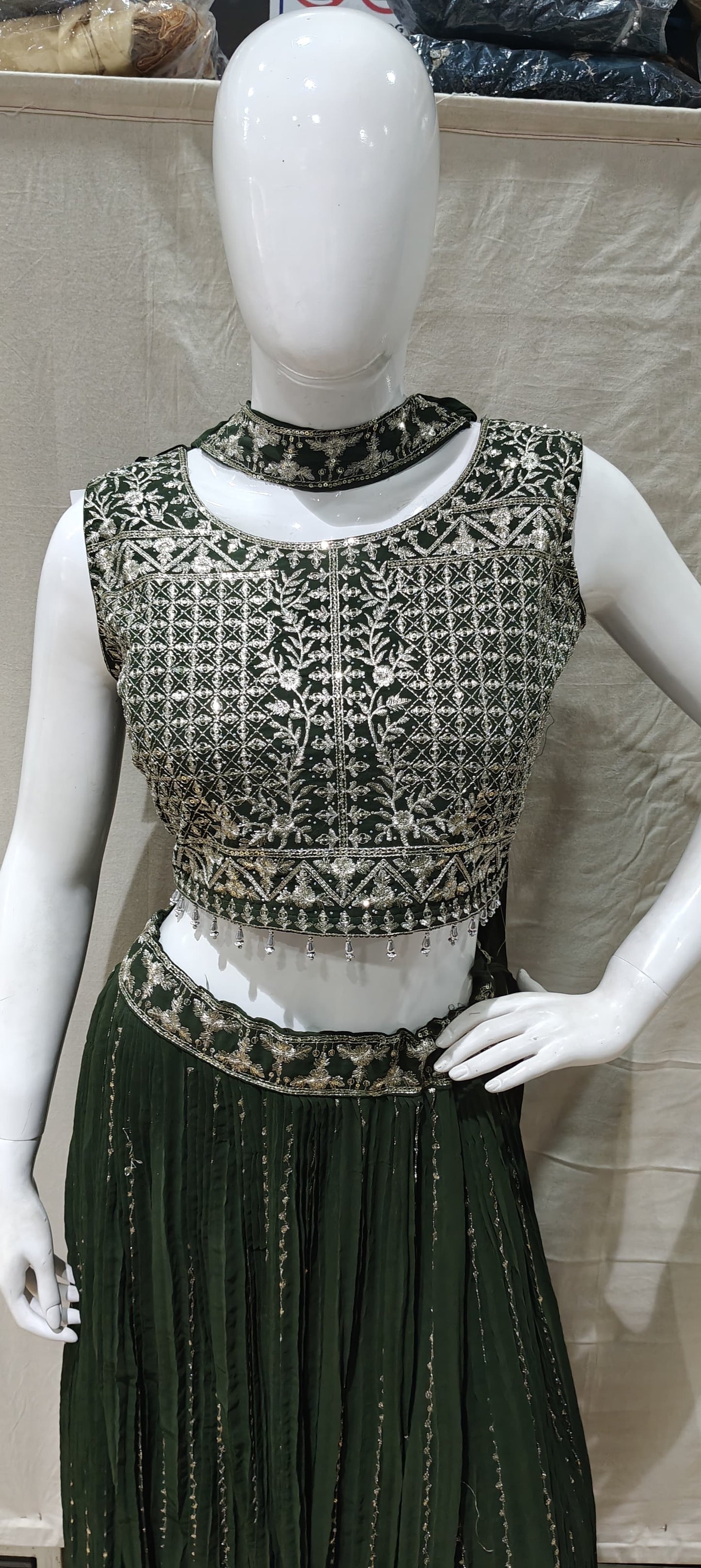 Silver zari work on green lehenga