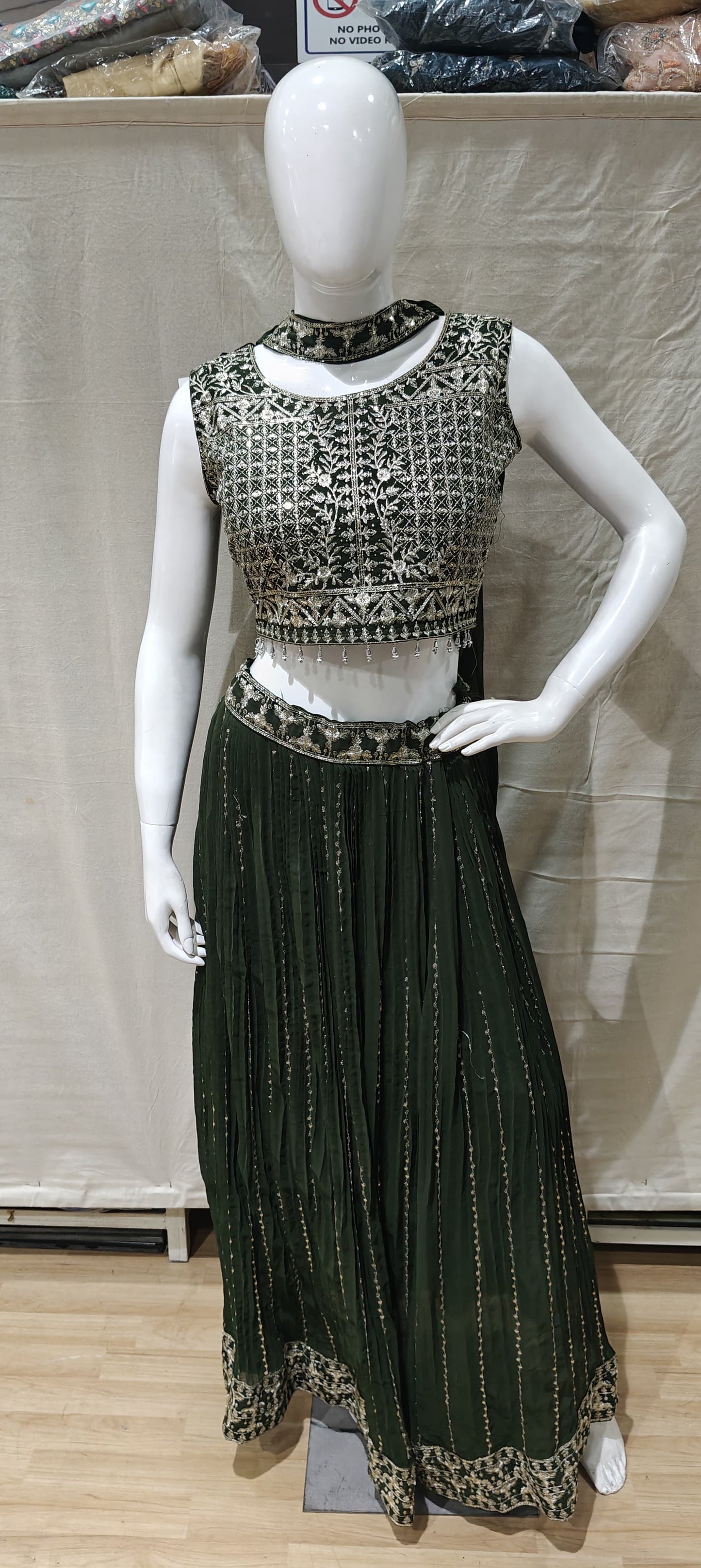 Silver zari work on green lehenga