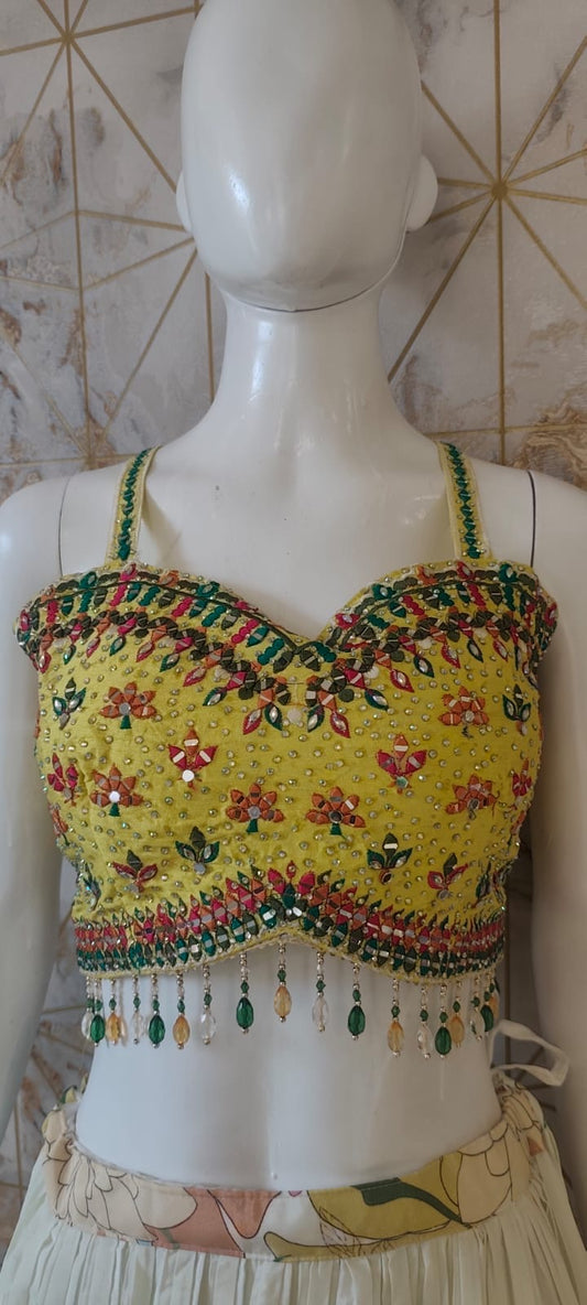 Floral cape yellow blouse lehenga