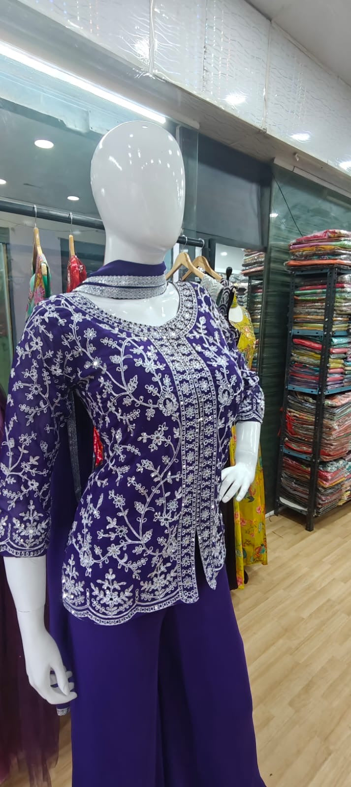 Purple peplum thread work