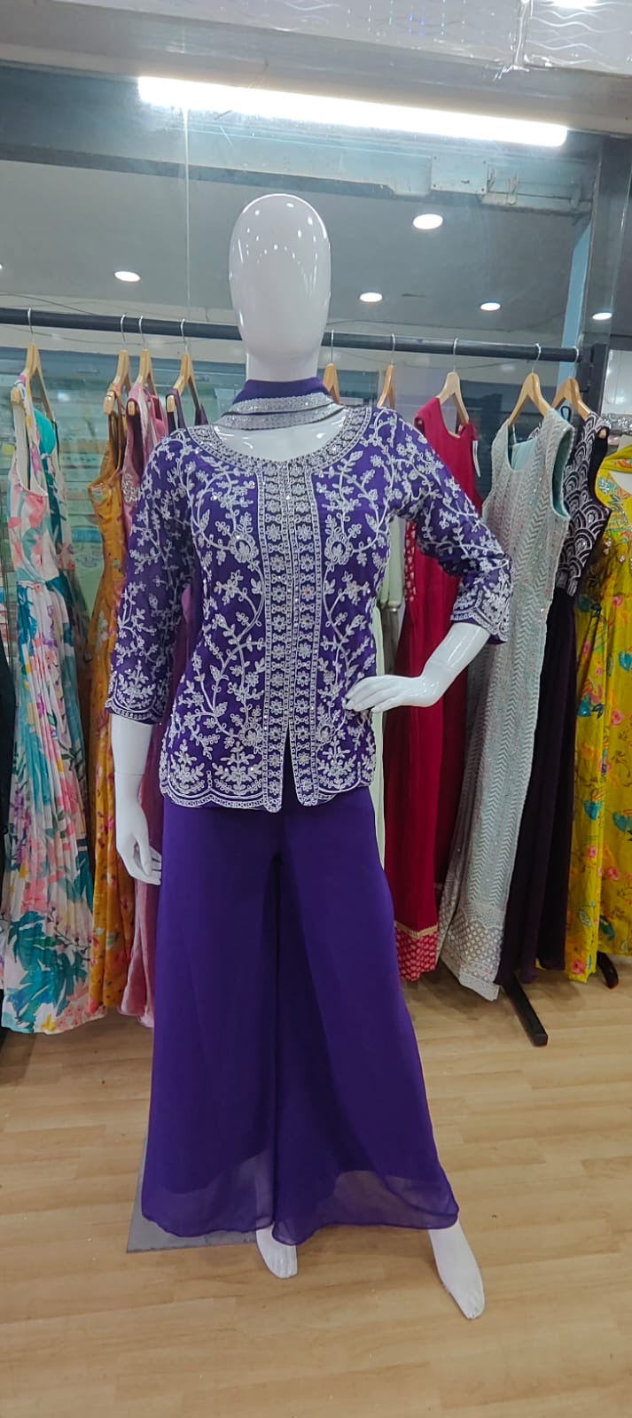 Purple peplum thread work