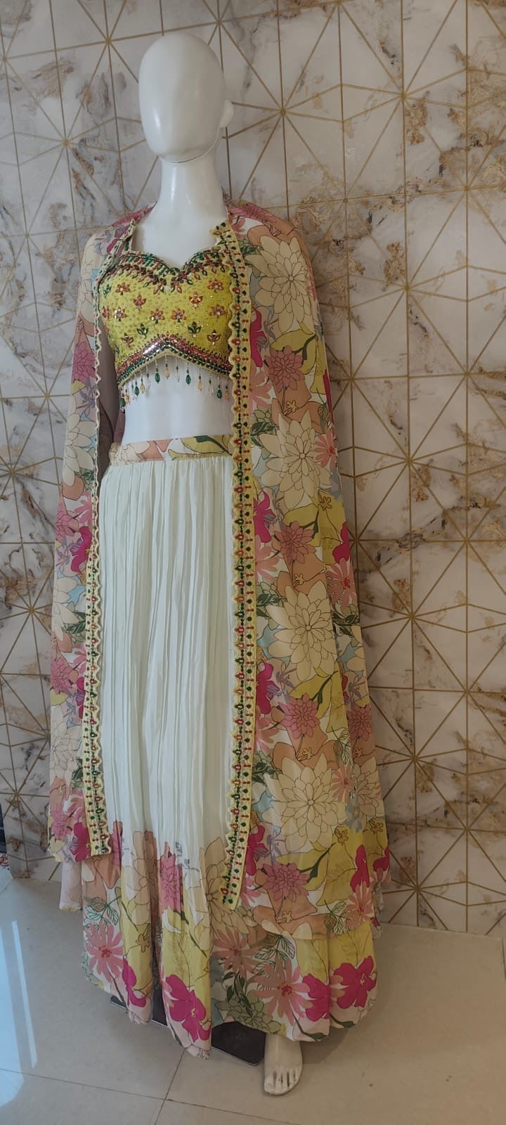 Floral cape yellow blouse lehenga