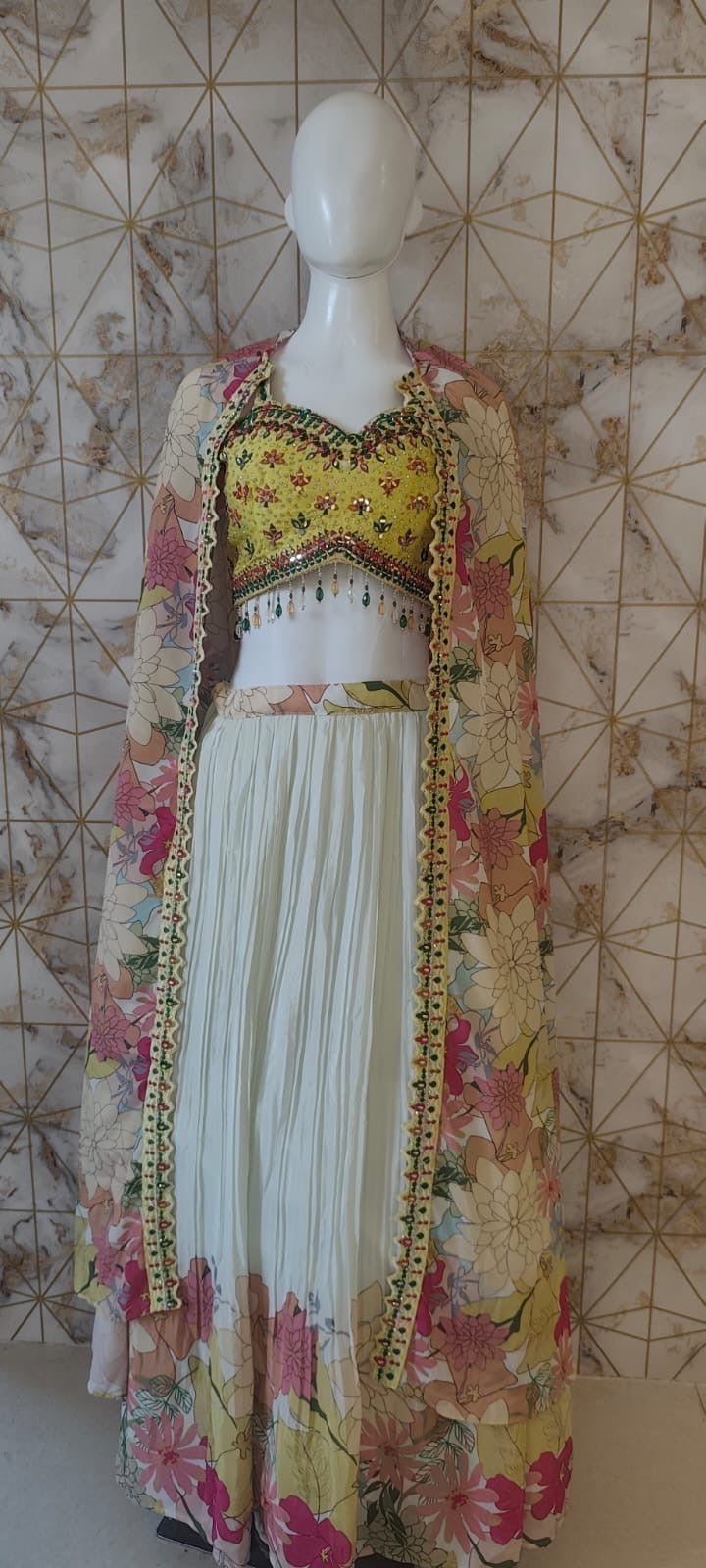 Floral cape yellow blouse lehenga